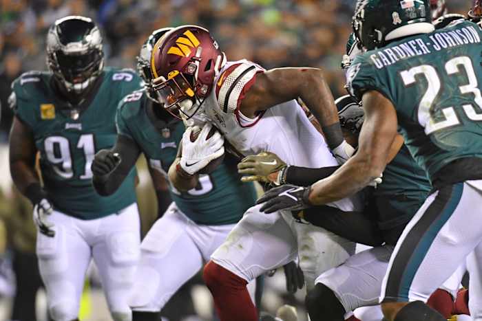 Washington Commanders running back Brian Robinson Jr. carries the ball against the Philadelphia Eagles.